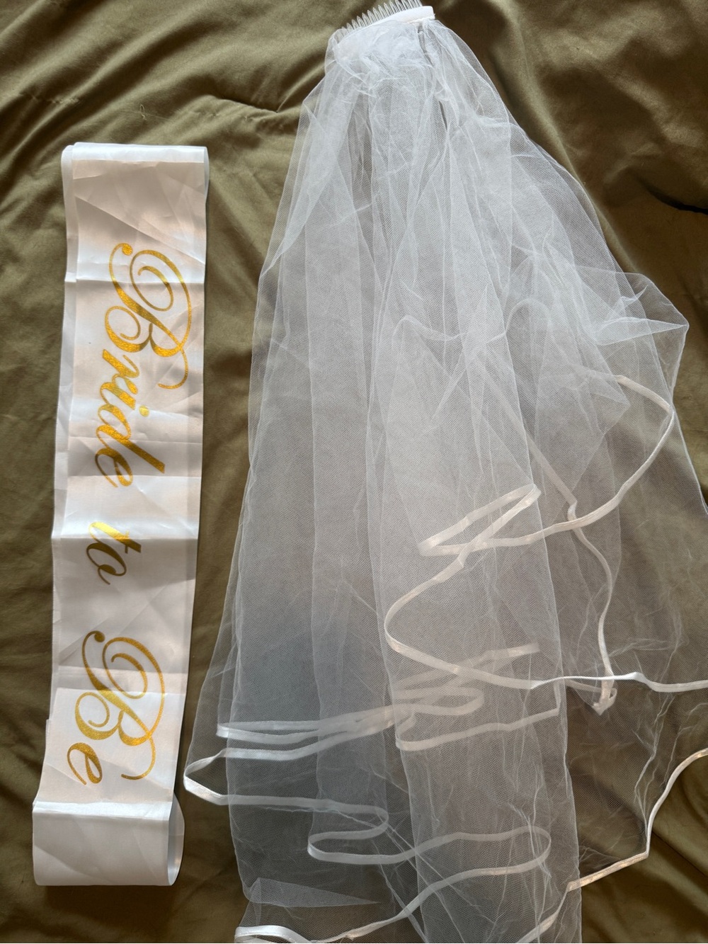 White veil & gold sash